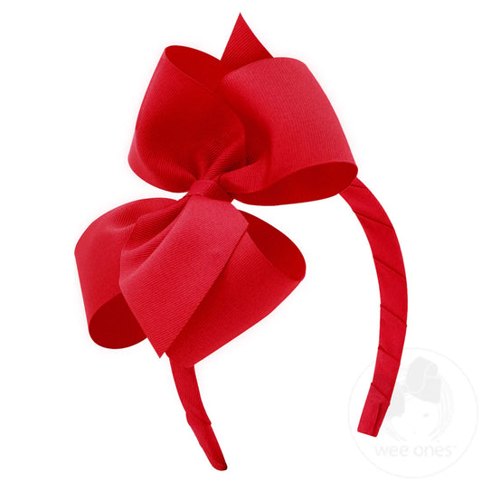 red bow attached to red headband