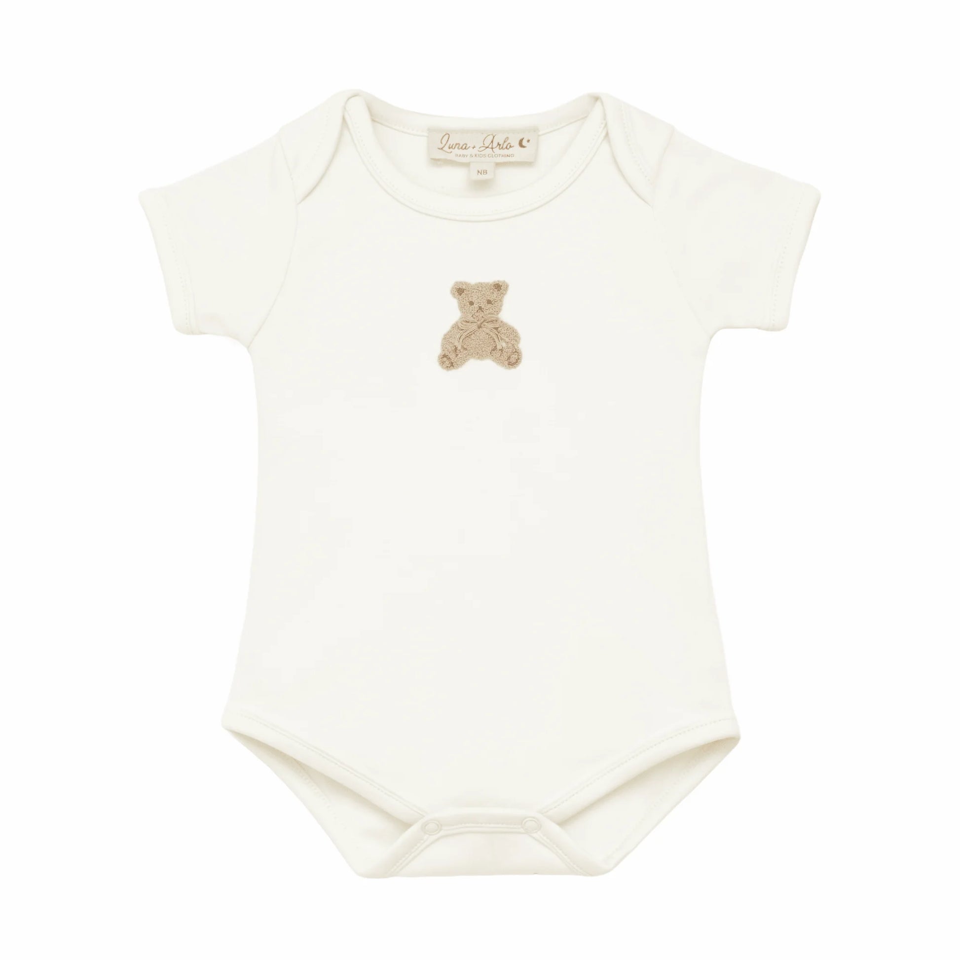 Lap shoulder ivory colored gender neutral onesie with embroidered teddy bear at the center chest.