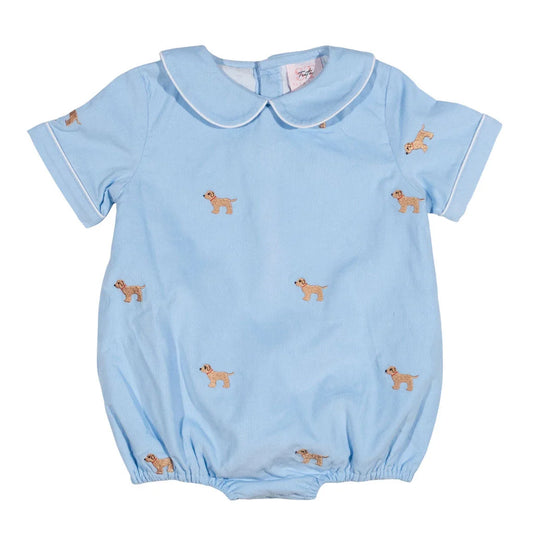 A light blue baby romper with a Peter Pan collar, short sleeves, and an all-over print of small tan dogs, shown flat against a white background.