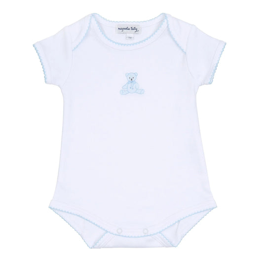 White lap shoulder onesie with sky blue trim and an embroidered bear on the center chest.