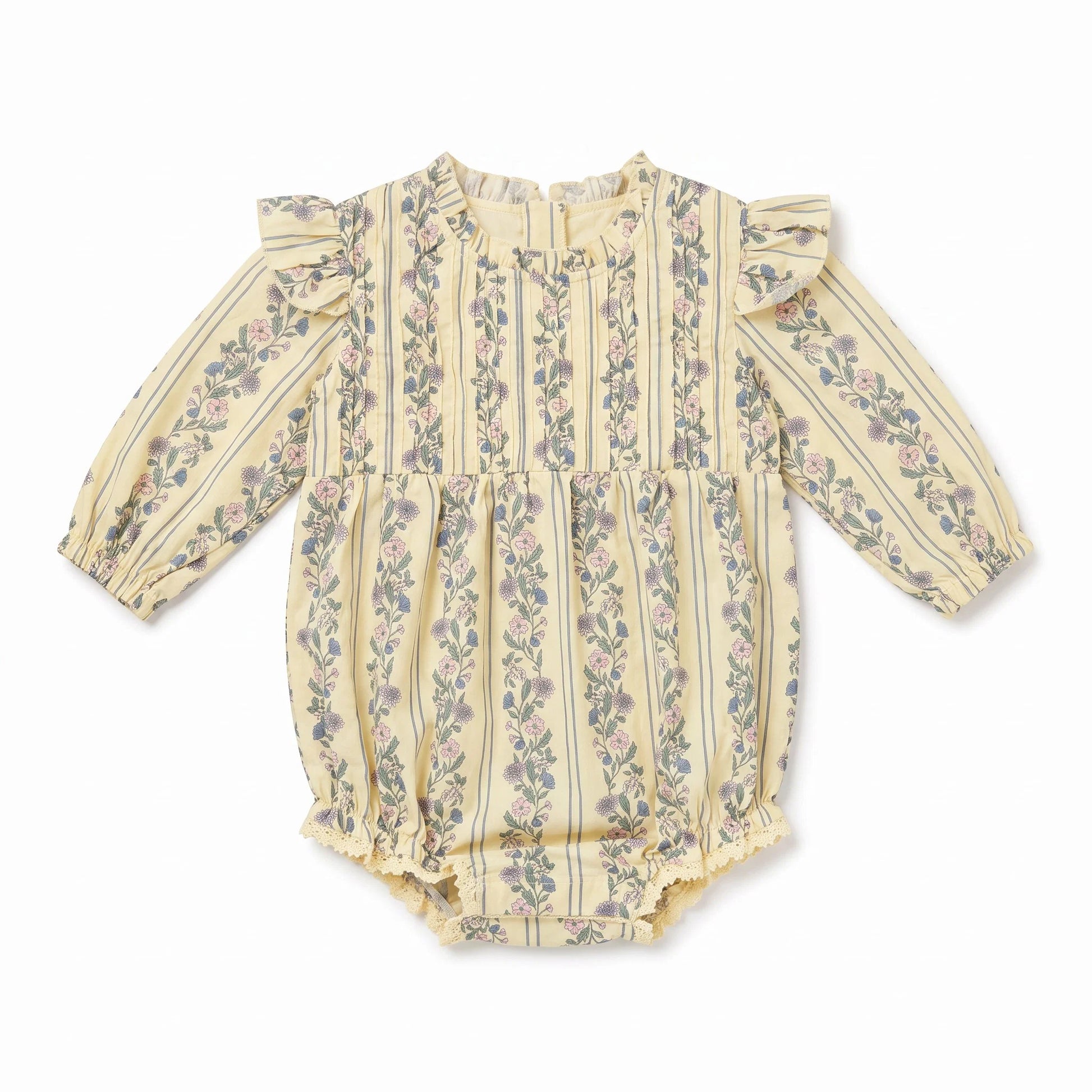 A baby long-sleeve romper in a pale yellowish-beige fabric with vertical stripes and a delicate pink and green floral pattern, featuring ruffled shoulders and a ruffled leg opening.