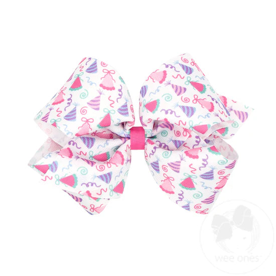 Pastel birthday hat print on white hair bow.