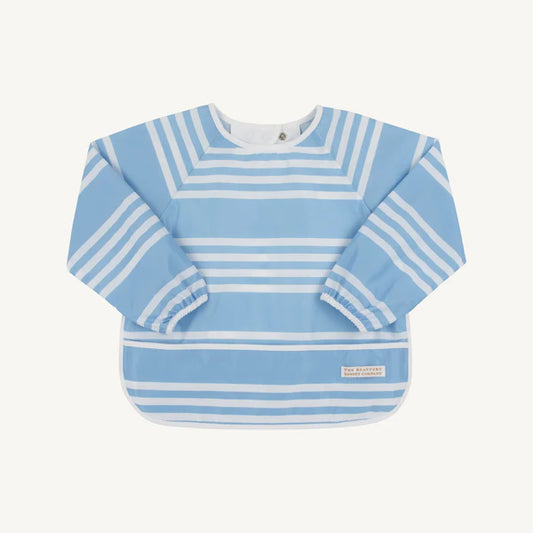 Blue and white striped baby bib on a light light bluebackground