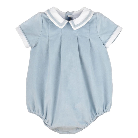 A light blue baby romper with a white collar and white sleeve cuffs, featuring a pleated front and elasticated leg openings.