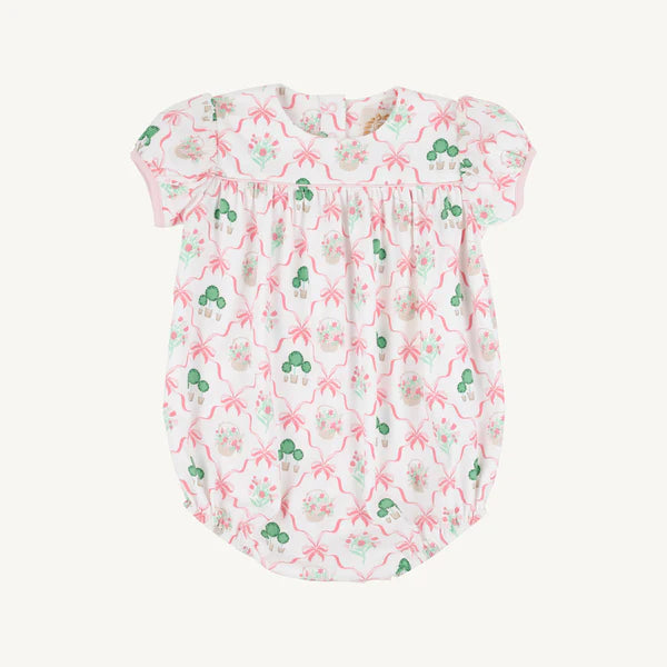 Baby bubble with green and pink floral and bow pattern on a white background