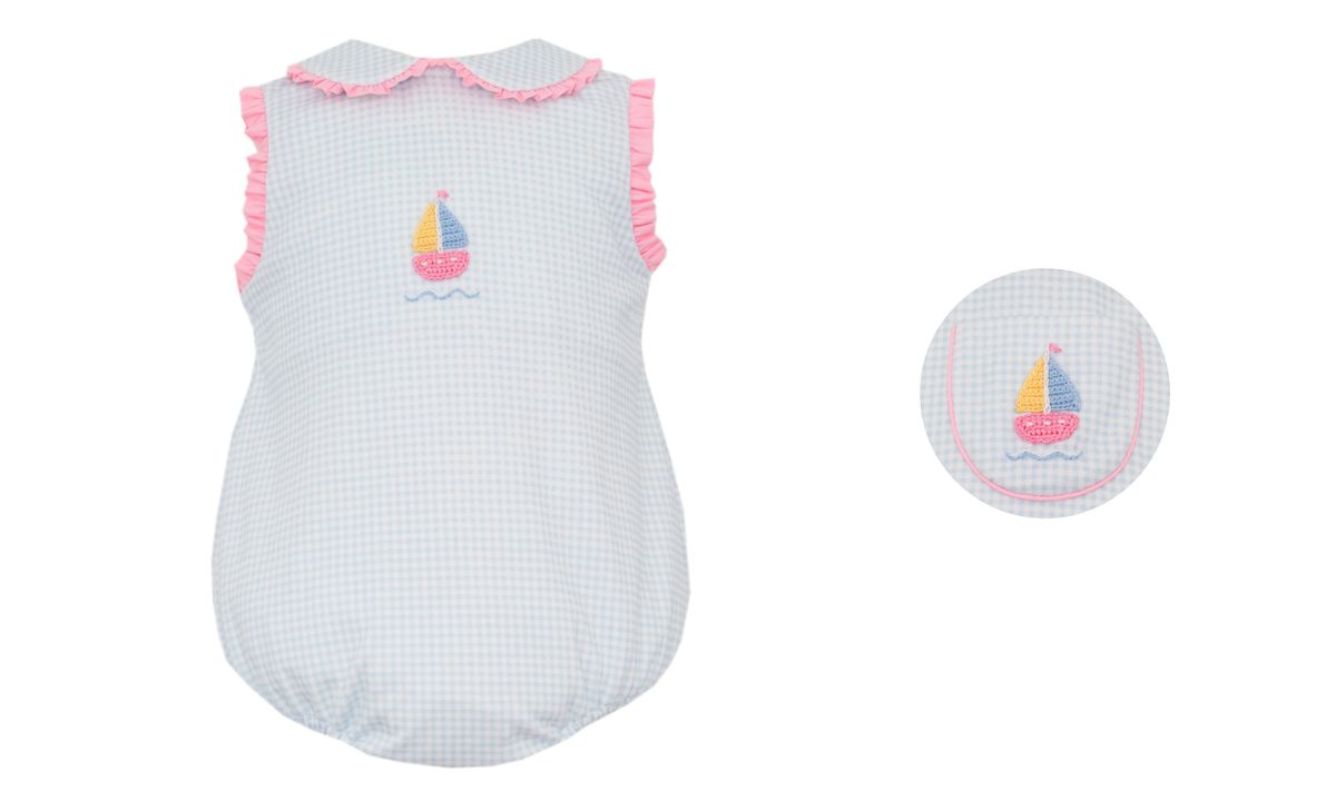 Blue and white checkered bubble with pink trim and sailboat design 