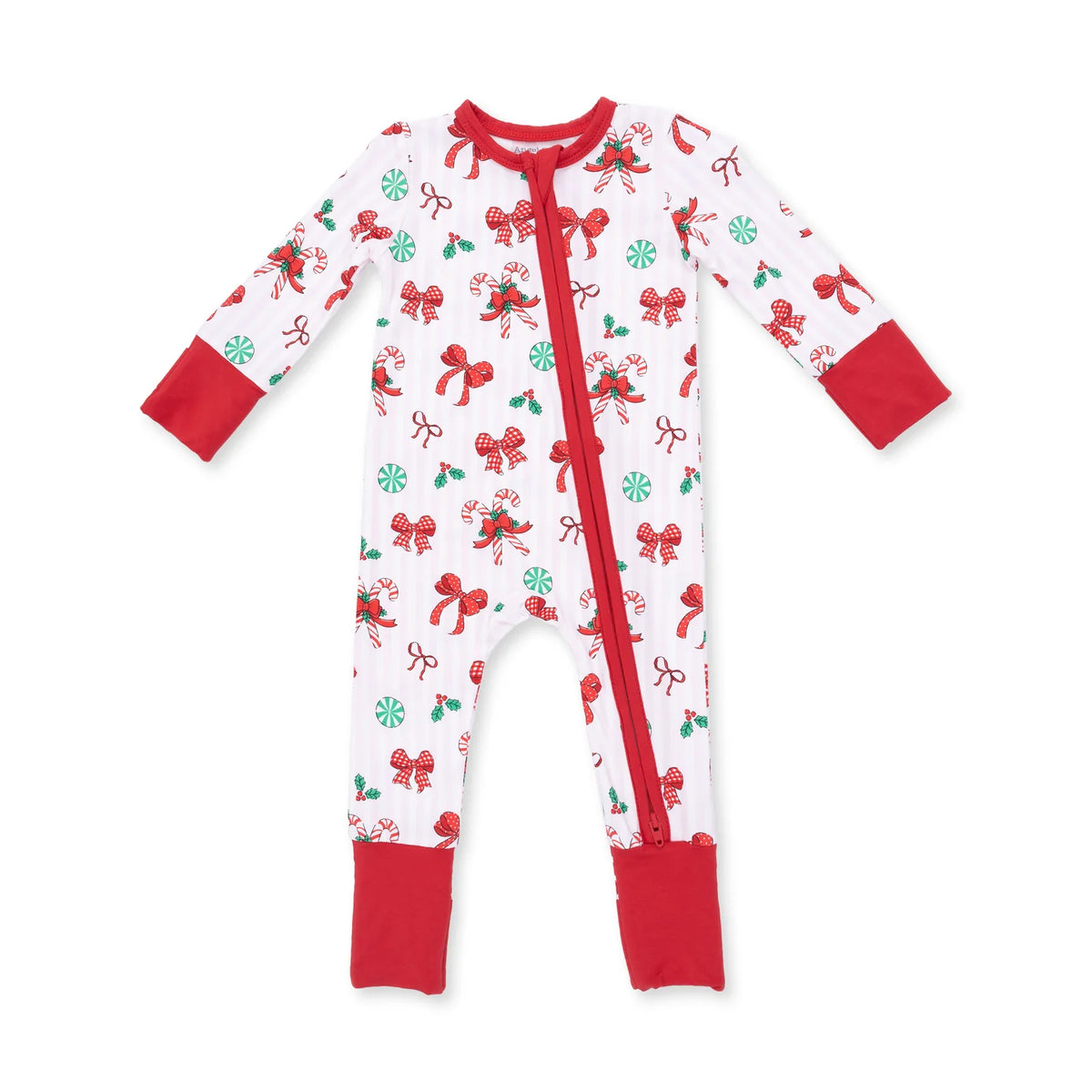 A baby's long-sleeve footed sleeper with a red zipper, featuring a white background with a festive print of red bows, green holly leaves, and red candy canes, finished with solid red cuffs and collar.