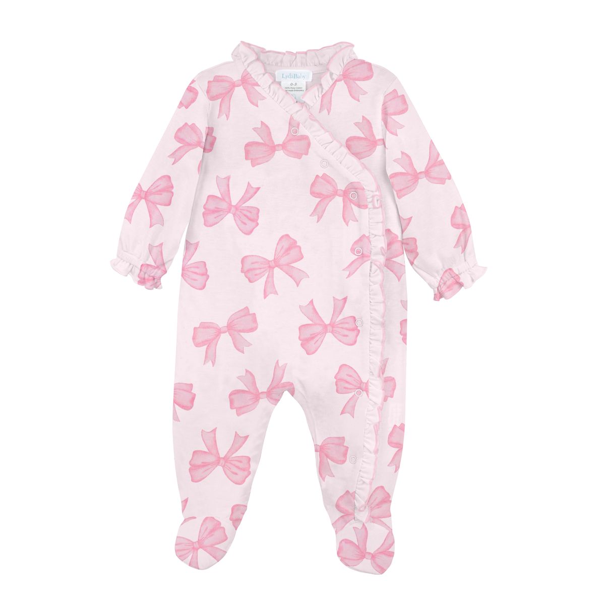 A baby footed sleeper in light pink with a repeating watercolor-style pink bow pattern, featuring ruffle trim along the collar, armholes, and leg cuffs.