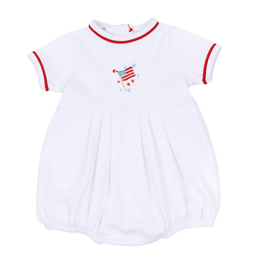White baby romper with red trim and American flag design on a white background