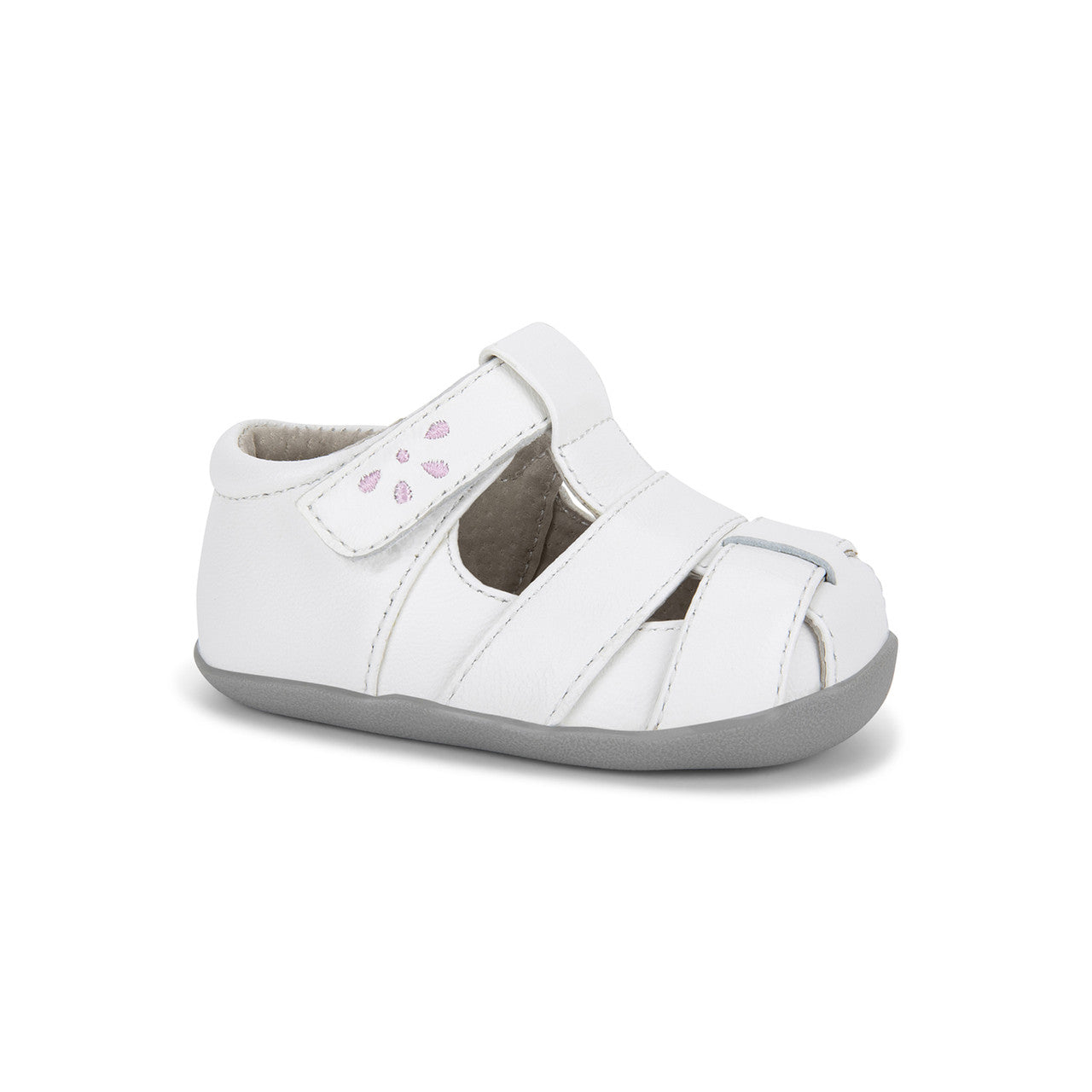 White children's sandal with a strap on a white background