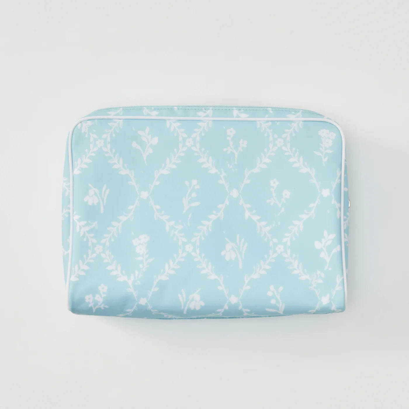 A light blue zippered pouch featuring a white floral trellis pattern, photographed flat against a clean white background.