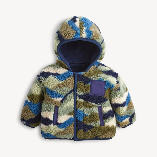 A baby hooded fleece jacket with a blue, green, and beige wavy camouflage pattern, featuring a dark blue magnetic closure, pockets, and hood lining, shown on a light gray background.