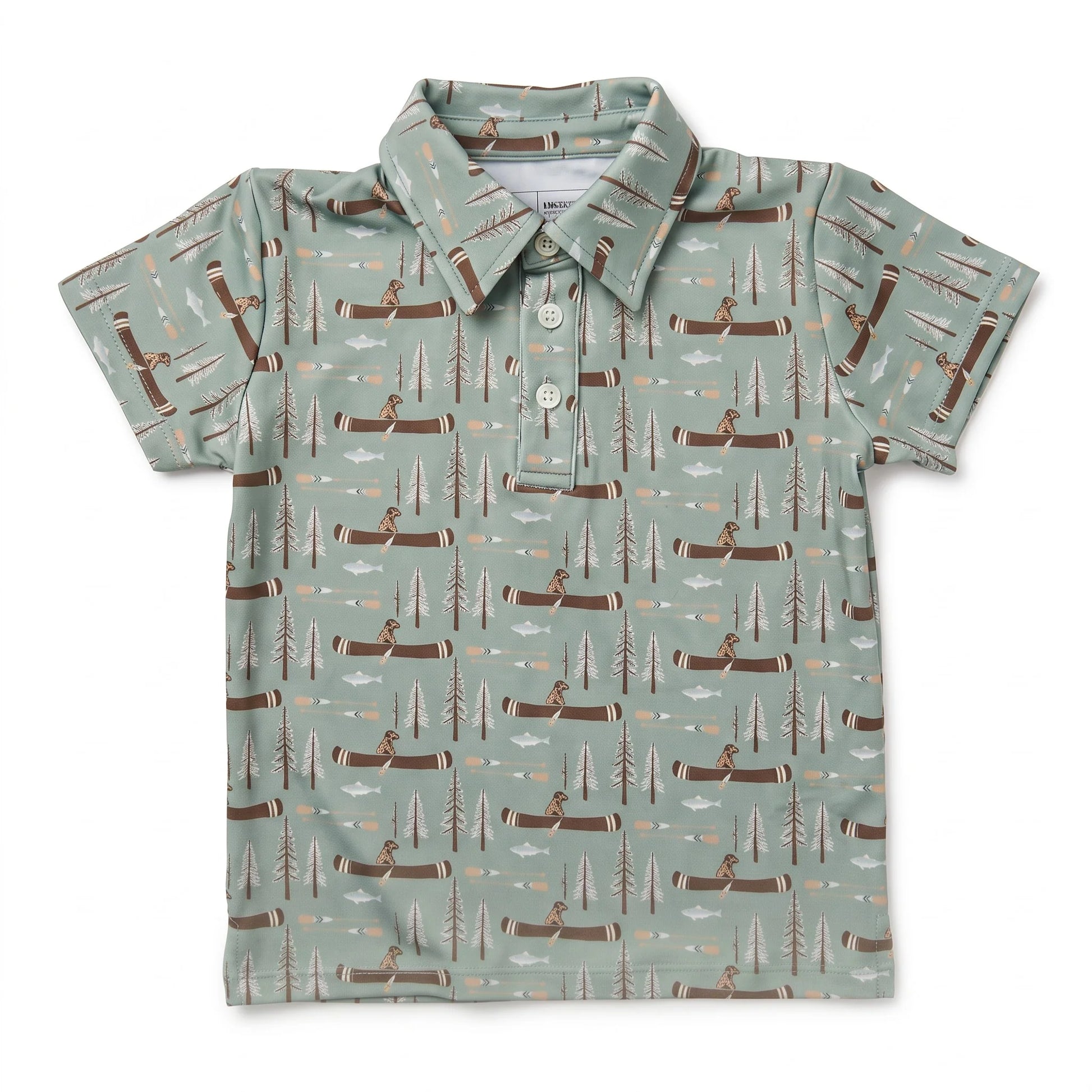 A short-sleeve polo shirt for kids, featuring a sage green background with an all-over repeating pattern of brown logs, pine trees, and figures canoeing on the water.