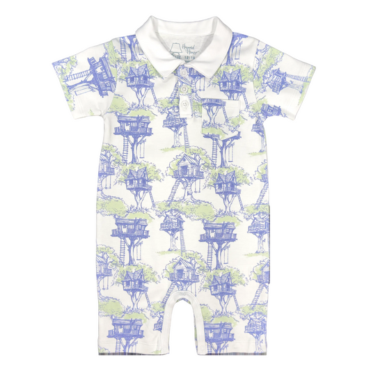 Short sleeve romper with blue and green treehouse design and white collar.