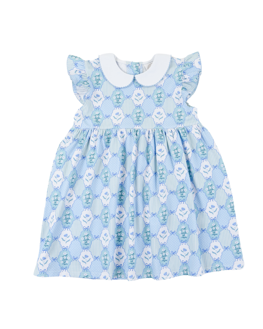 Blue floral dress with floral and bow design with ruffled sleeves and a white collar.