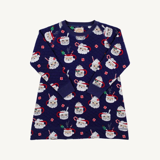A navy blue long-sleeve quilted dress  with an all-over Christmas-themed print of mugs filled with hot cocoa, candy canes, and Santa hats, displayed flat against a light off-white background.