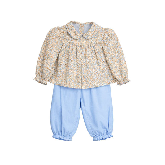 A toddler girl's two-piece outfit featuring a long-sleeve blouse with a yellow and blue floral print and a Peter Pan collar, paired with light blue pants with elastic cuffs.