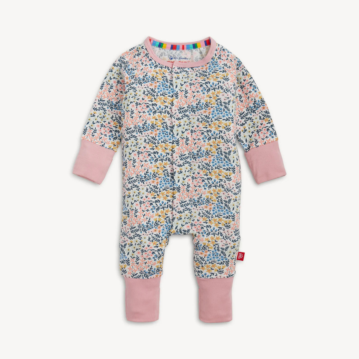 Baby coverall with pink cuffs and pastel floral pattern.