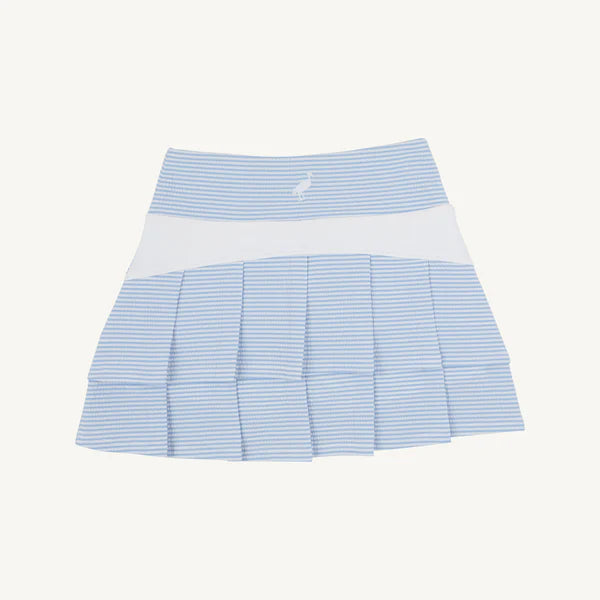 Blue and white striped athletic skirt on a light blue background with built in white shorts