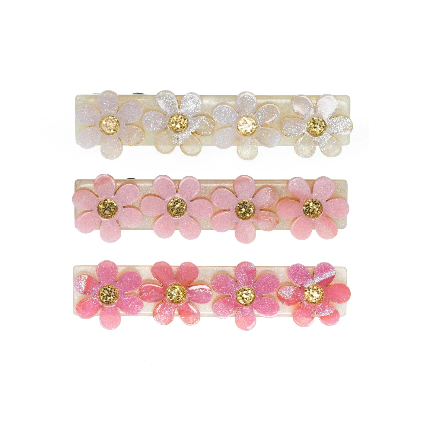 Set of three floral hair clips with pink and gold flowers on a white background