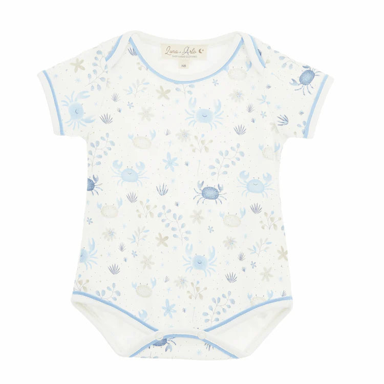 Baby bodysuit with blue crab and shell pattern on a white background