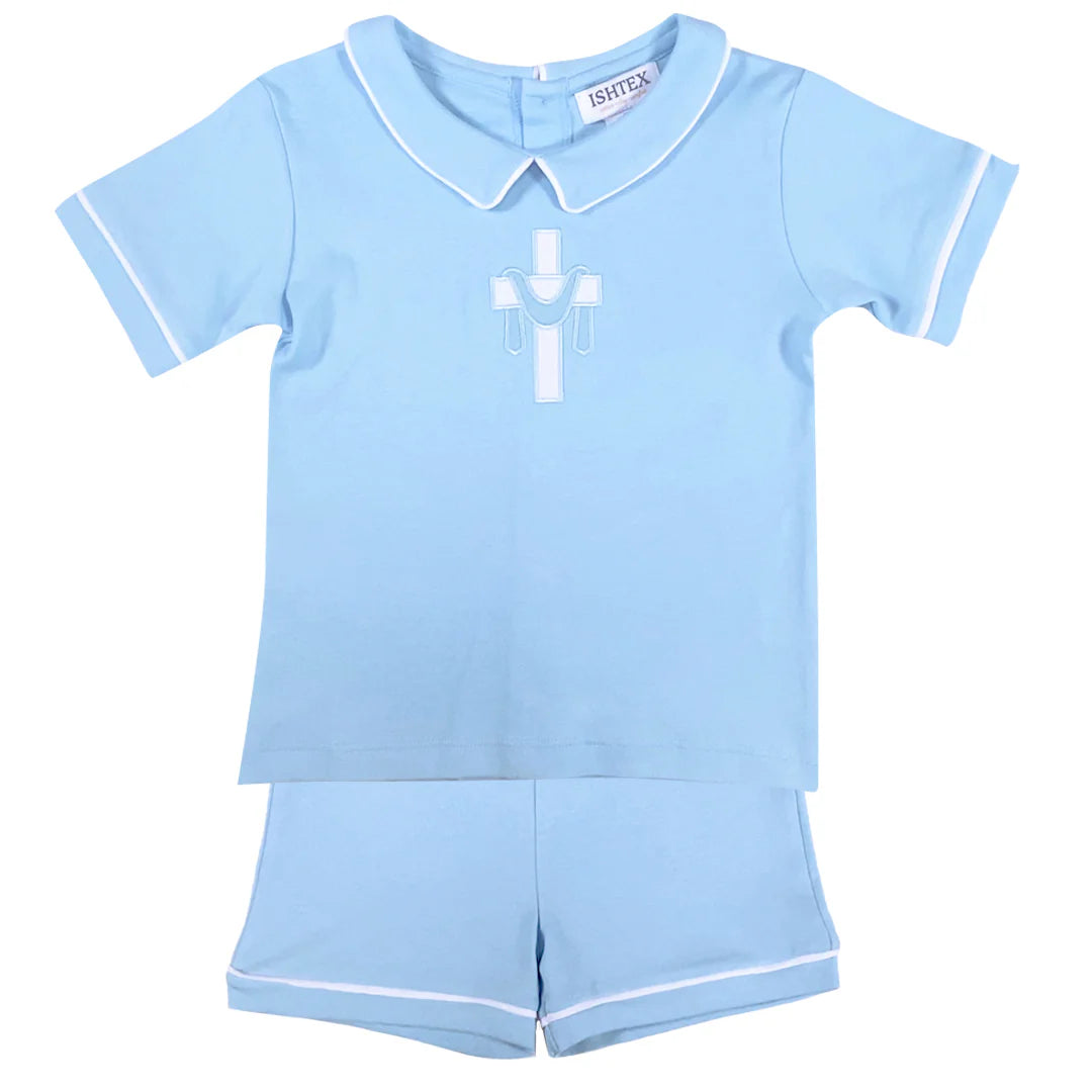 Light blue short sleeve shirt with white piping and matching shorts; cross applique on shirt.
