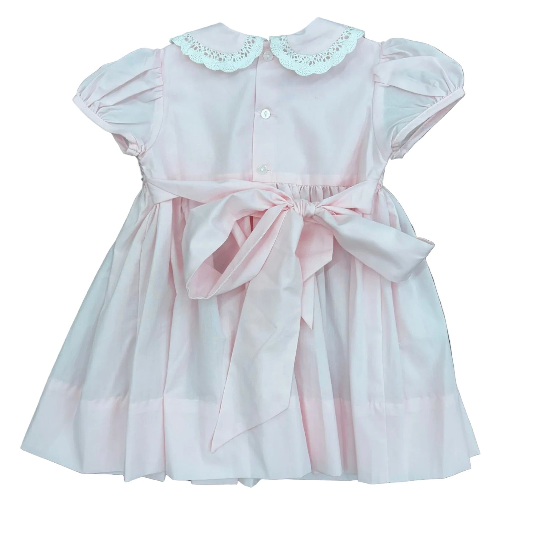 Bow detail on the back of the pink cupcake smocked dress.