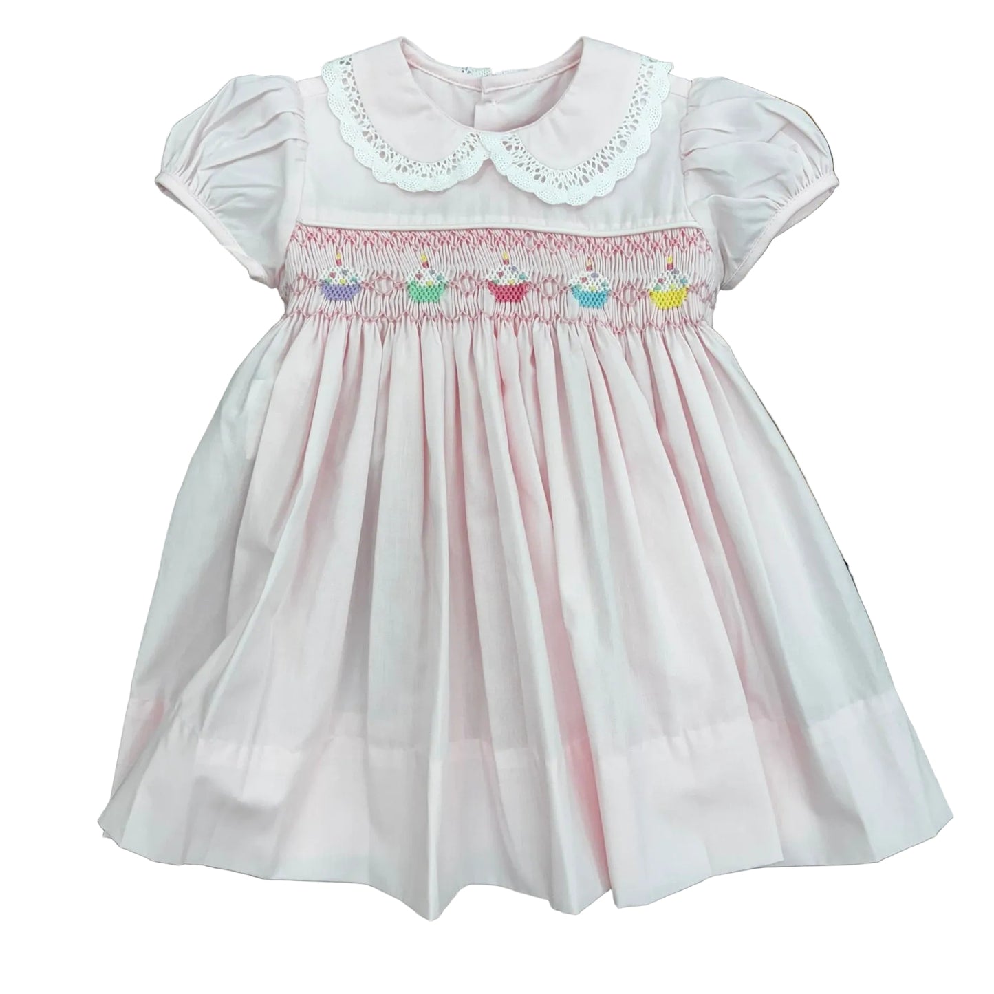 Pale pink dress with lace color detail and cupcake embroidery on smocked bodice.