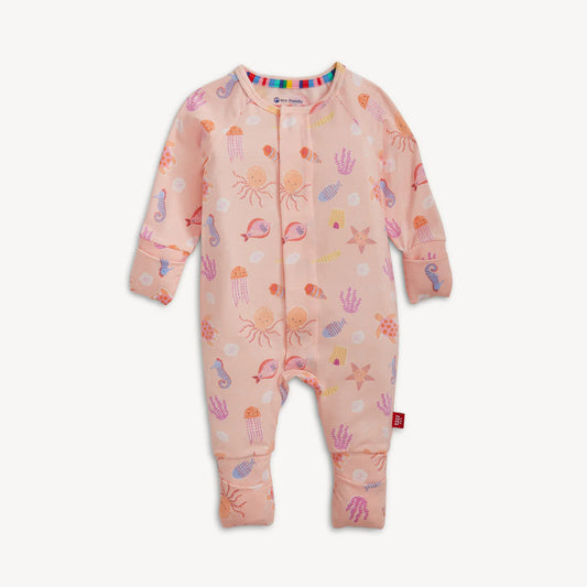 Colorful sea creatures on a pink background on a baby one-piece.