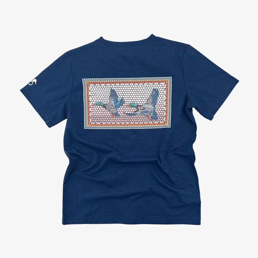 Navy blue performance shirt with a duck graphic mosaic design on the back against 