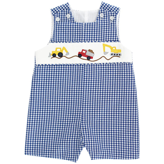 Blue gingham baby romper with construction vehicle design on the chest