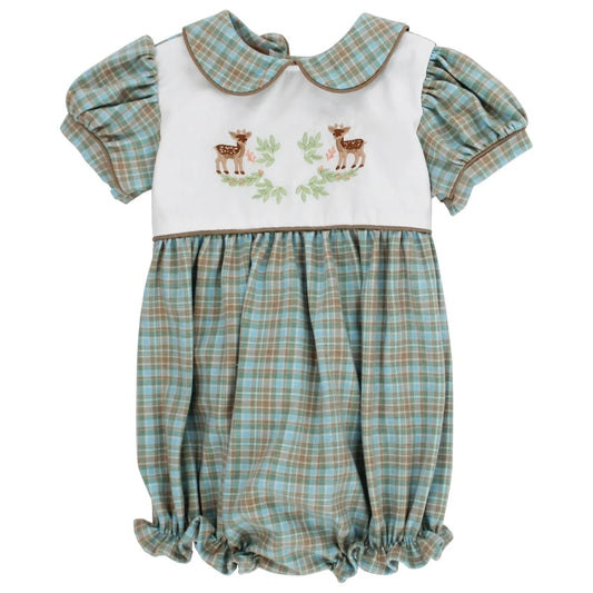 A baby romper with a white bib-style bodice featuring embroidered deer and green leaves, paired with a light blue and tan plaid skirt and matching plaid short sleeves.