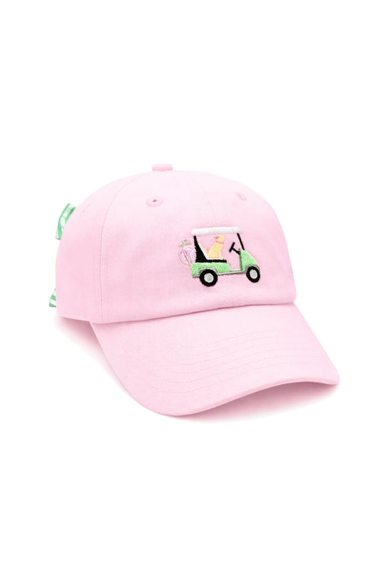 Pink baseball cap with golf cart with dog and bow in the back 