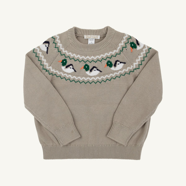 A beige crewneck knit sweater featuring a decorative yoke pattern of green, white, and black birds with orange beaks, laid flat against a light cream background.