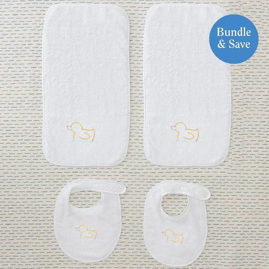 Set of white baby bibs and burp cloths with gold duck designs 