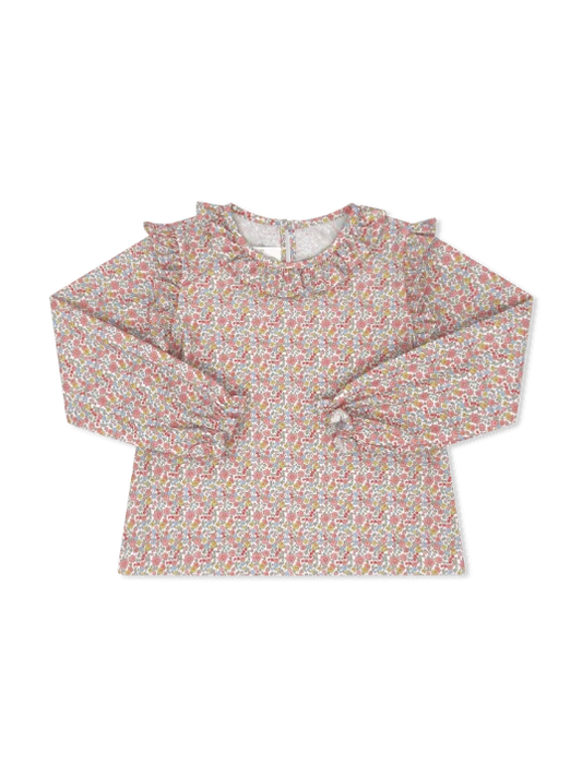 A long-sleeve top for toddlers or young girls, featuring an all-over dense floral print in soft pink, green, and blue on a light beige base. The top has a ruffled mock neck and ruffle details along the shoulders and cuffs