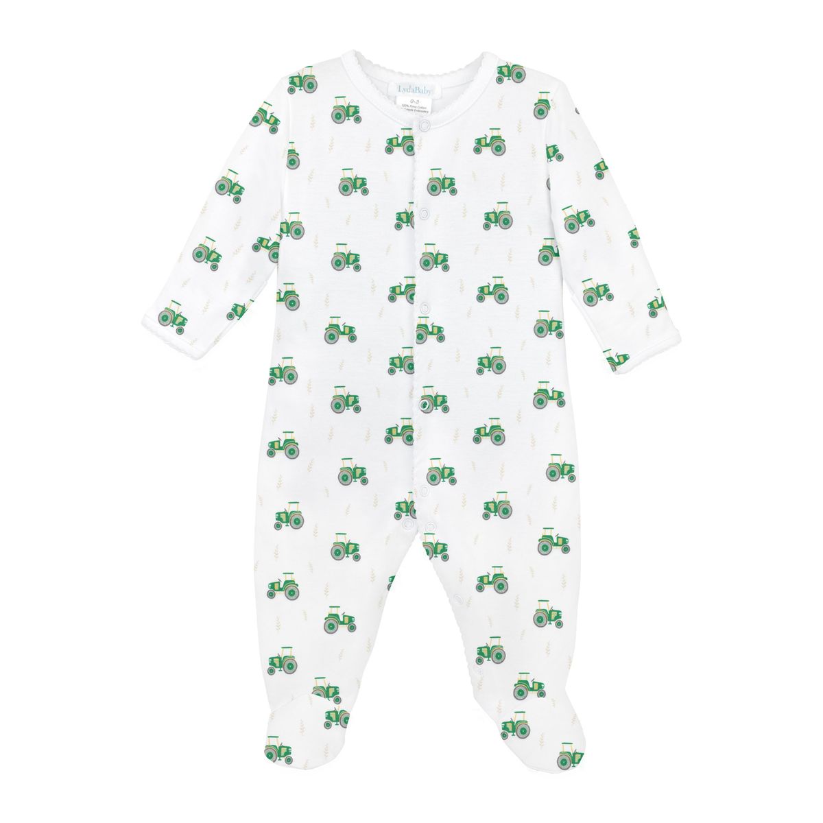 A white long-sleeve baby footed sleeper with an all-over green tractor pattern, shown flat against a white background.