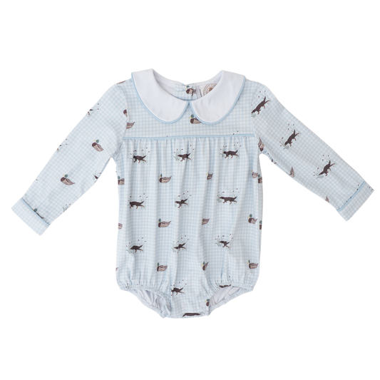 Baby romper with dog pattern on a white background