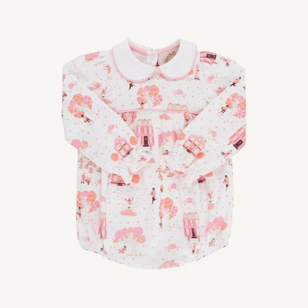 A baby long-sleeve shirt with a Peter Pan collar, featuring a pink and white cherry blossom and castle pattern, displayed flat against a light cream background.