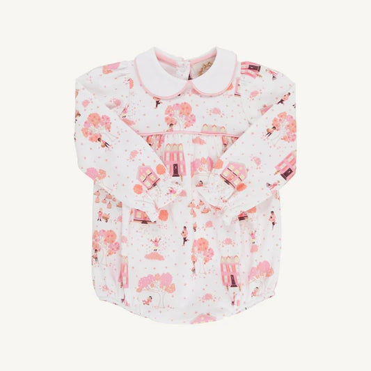 A baby long-sleeve shirt with a Peter Pan collar, featuring a pink and white cherry blossom and castle pattern, displayed flat against a light cream background.