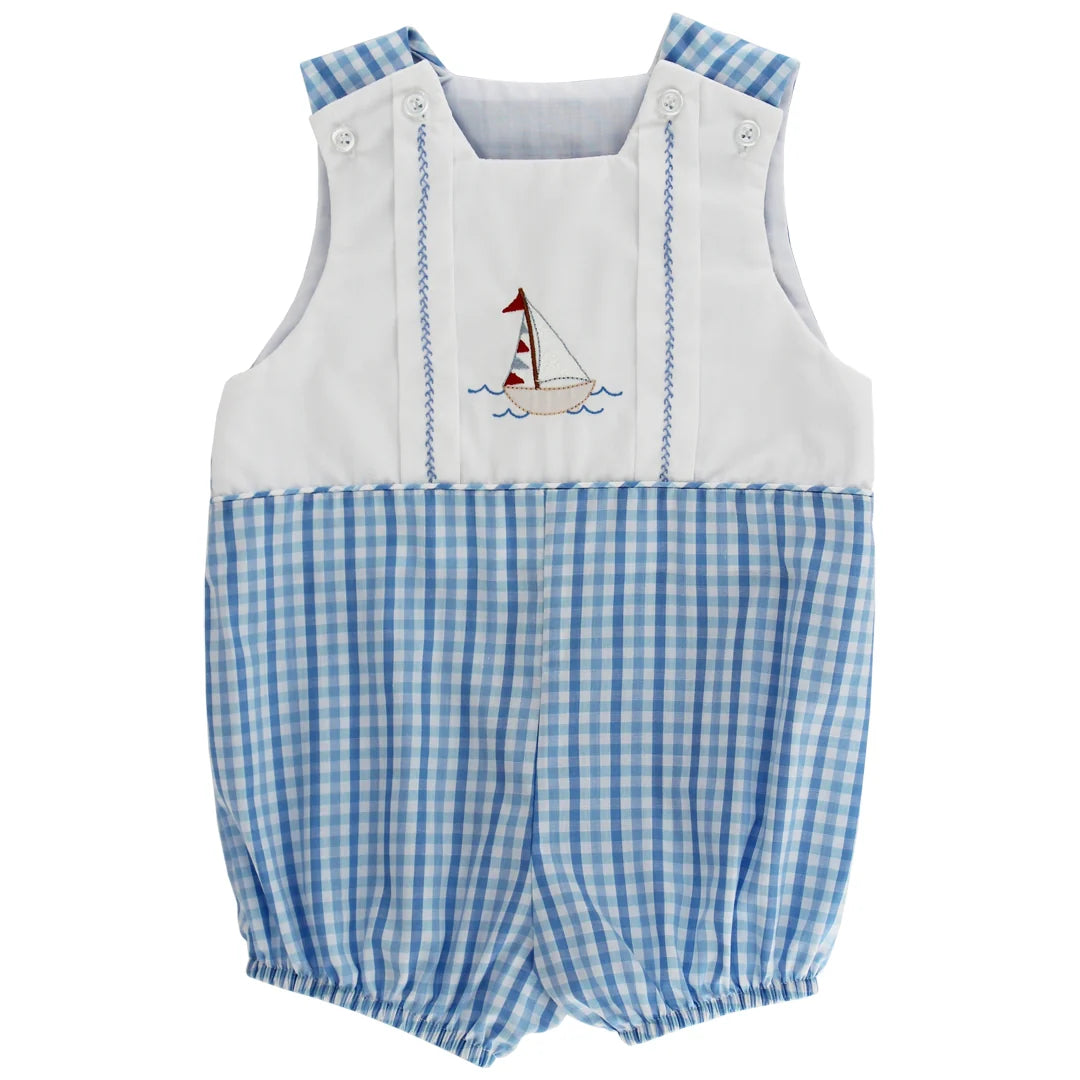 Baby romper with blue checkered pattern and sailboat design on a white background