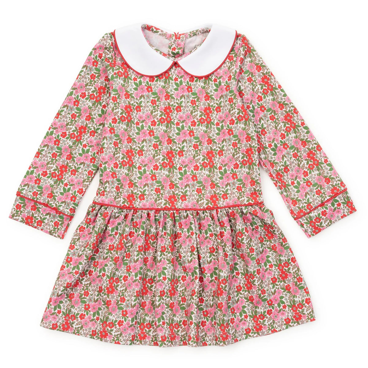 A long-sleeve children's dress with a pink and red floral print on a light background, featuring a contrasting white Peter Pan collar and red piping details.