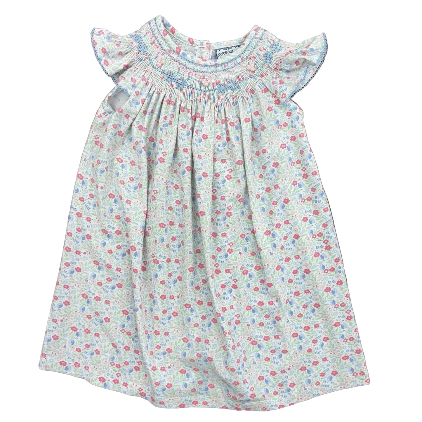 Smocked floral dress with bow and rosette detail and ruffle sleeves.