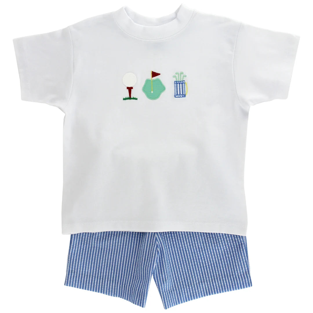 White t-shirt with golf-themed design and blue striped shorts 