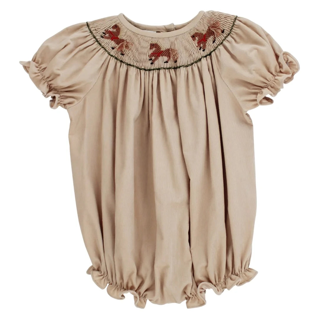 A beige short-sleeve baby dress with a smocked round neckline featuring embroidered brown horses, set against a plain white background.