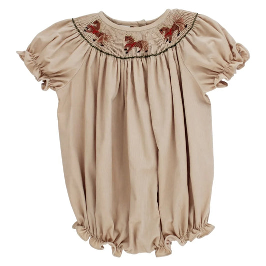 A beige short-sleeve baby dress with a smocked round neckline featuring embroidered brown horses, set against a plain white background.