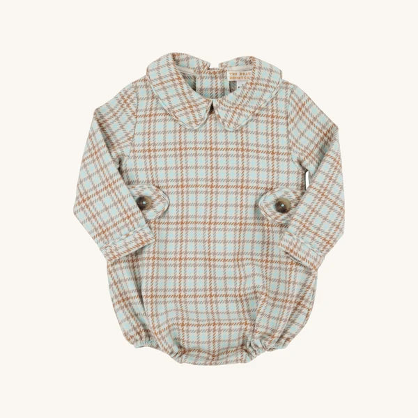 A long-sleeve baby romper in a beige and orange plaid pattern, styled like a collared shirt with buttoned cuffs, shown on a plain off-white background.