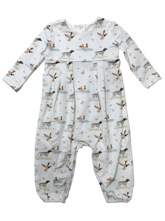 A baby long-sleeve footless romper with an all-over duck hunting print featuring ducks, dogs, and birds on a white background