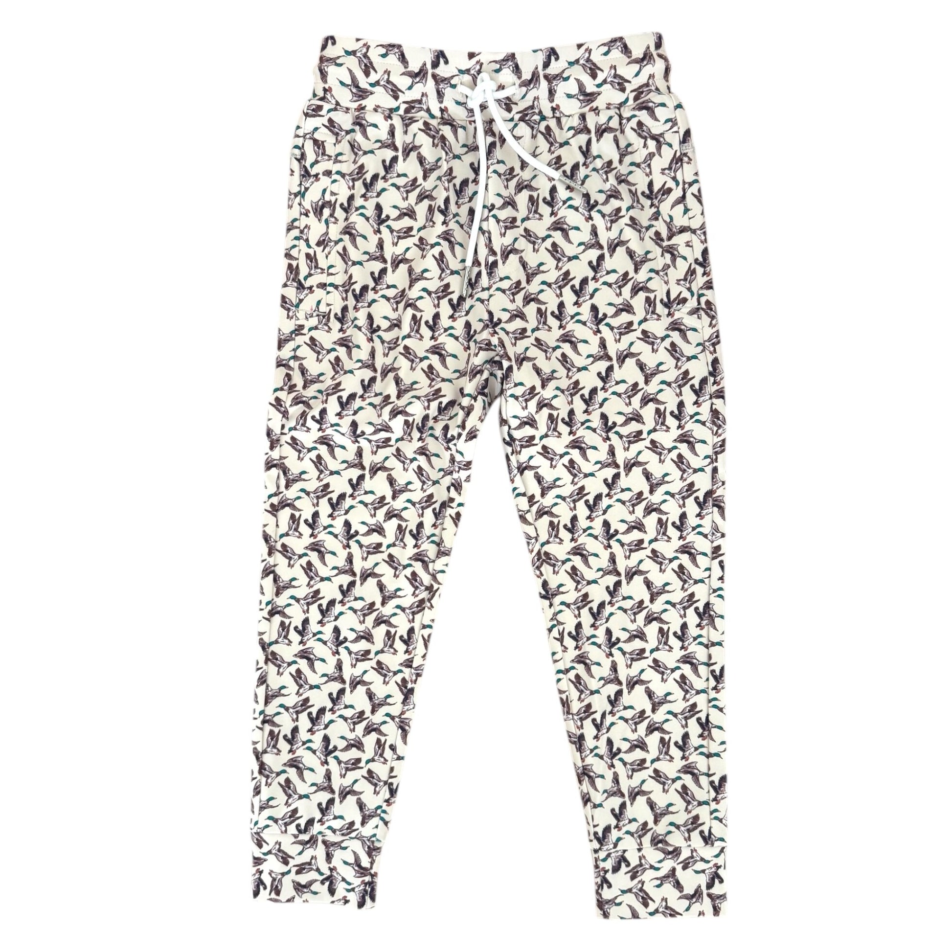 A pair of jogger-style pants with an all-over duck print on a white background, featuring a white drawstring waist and elastic cuffs.