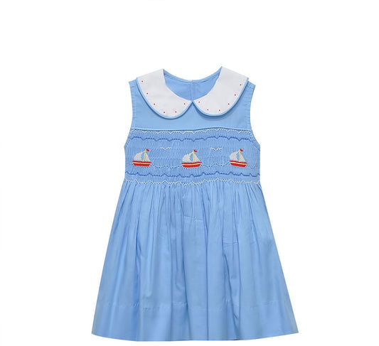Light blue smocked dress with embellished white collar and embroidered sailboats.